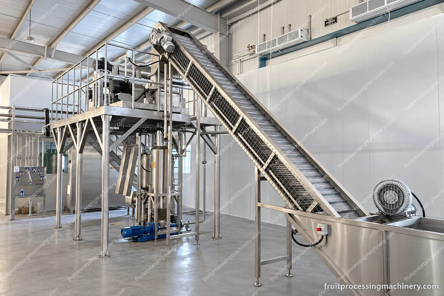Inclined flighted-belt assembly with upper drive, side mesh guarding and a high-level access platform.
